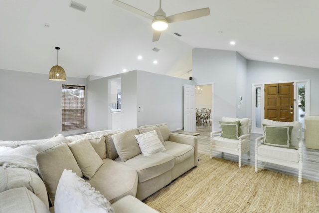 living room with ceiling fan, high vaulted ceiling, and light hardwood / wood-style floors