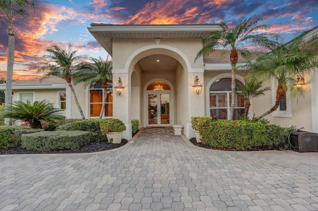 exterior entry at dusk with french doors