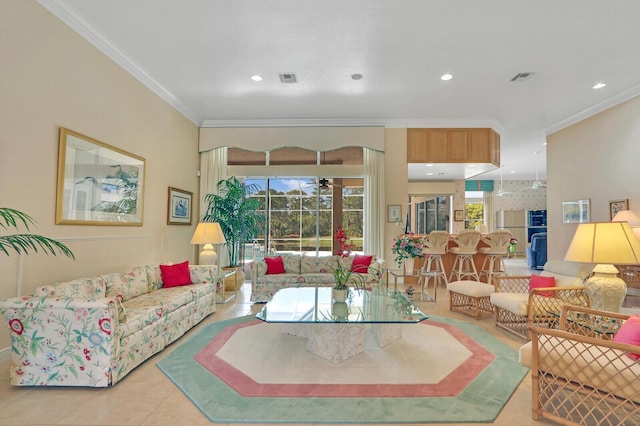 living room with ornamental molding and light tile patterned floors