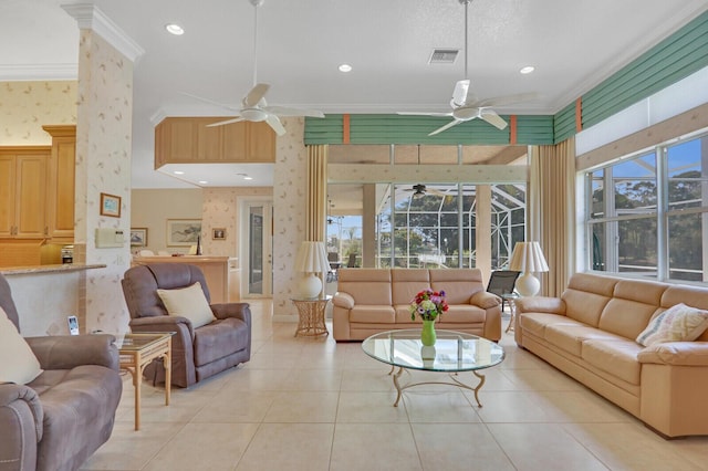 living room featuring light tile patterned floors, crown molding, and ceiling fan