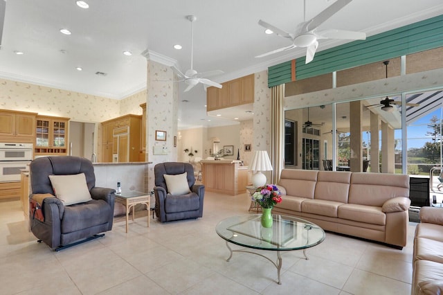 tiled living room with ornamental molding and ceiling fan