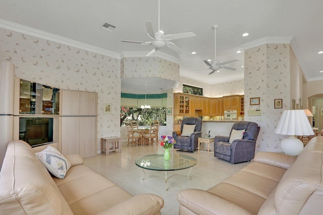 living room featuring crown molding, light tile patterned flooring, and ceiling fan