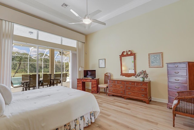 bedroom featuring access to exterior, ceiling fan, and light hardwood / wood-style flooring