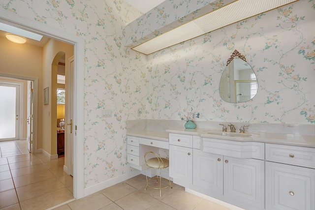 bathroom featuring tile patterned flooring and vanity