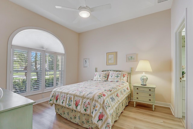 bedroom with light hardwood / wood-style flooring and ceiling fan