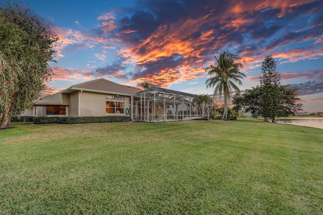 exterior space with a water view and a lanai