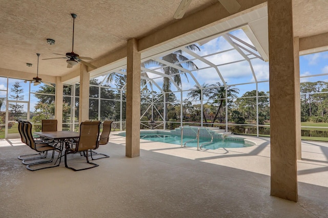 view of swimming pool featuring a lanai, a patio, and ceiling fan