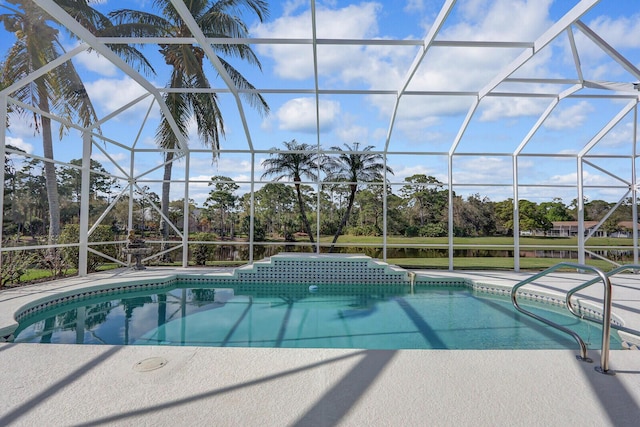 view of pool featuring a patio area and glass enclosure