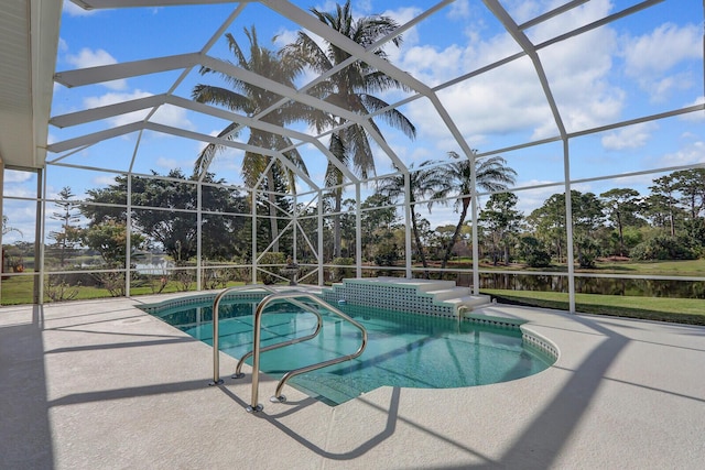 view of swimming pool with a lanai and a patio area