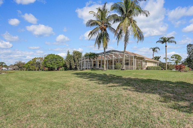 view of yard with glass enclosure