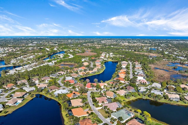 bird's eye view featuring a residential view and a water view