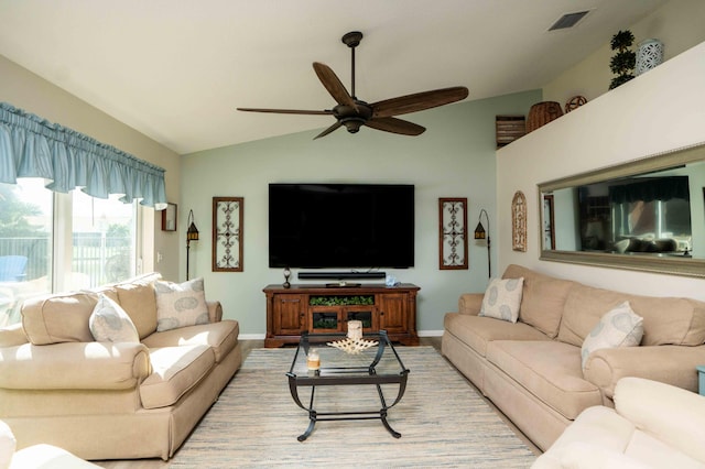 living room featuring vaulted ceiling and ceiling fan