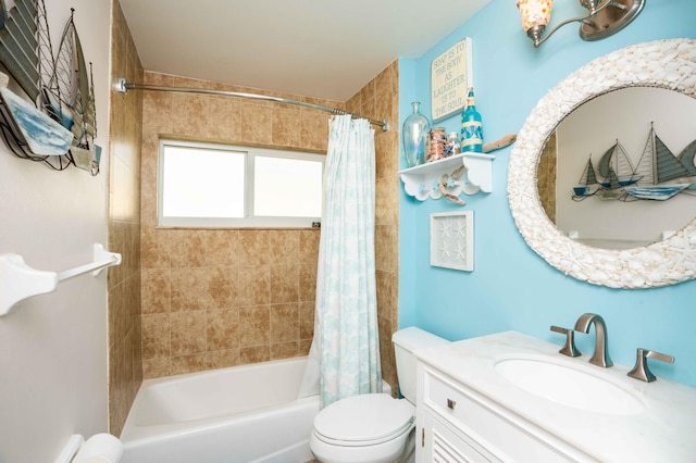 full bathroom with vanity, shower / tub combo with curtain, and toilet