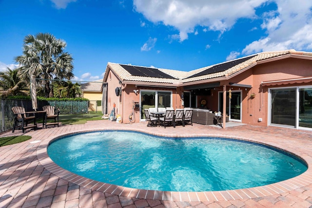 view of swimming pool with outdoor lounge area and a patio