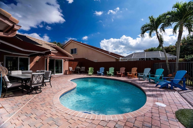 view of swimming pool with a patio