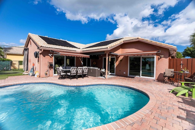 view of swimming pool with an outdoor living space and a patio area