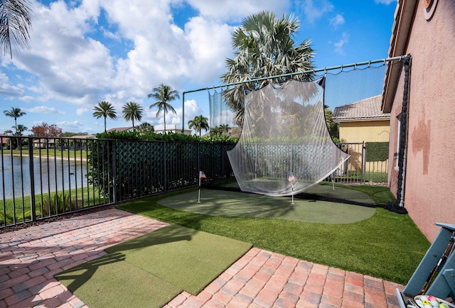 view of yard featuring a water view and a patio area