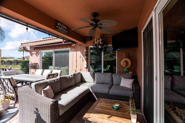 view of patio / terrace with ceiling fan and outdoor lounge area