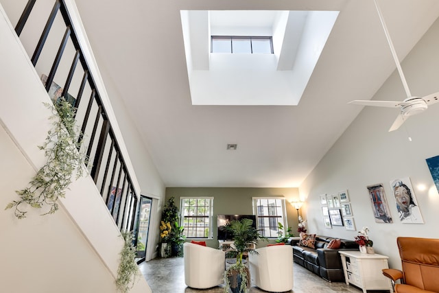 interior space featuring ceiling fan and high vaulted ceiling