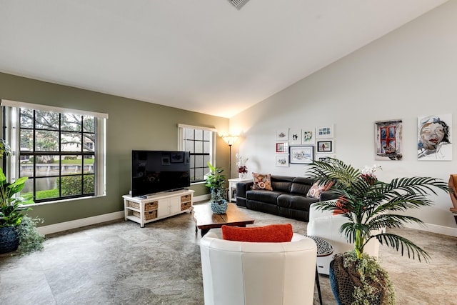 living room with high vaulted ceiling