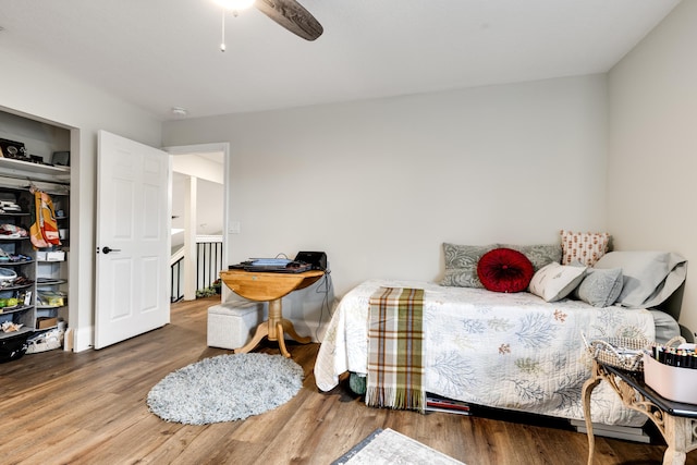 bedroom featuring hardwood / wood-style floors and ceiling fan