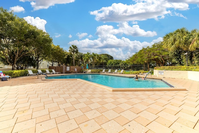 view of swimming pool featuring a patio