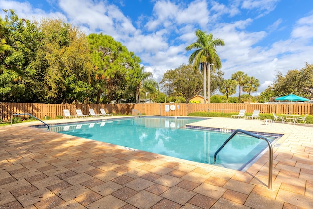 view of swimming pool with a patio