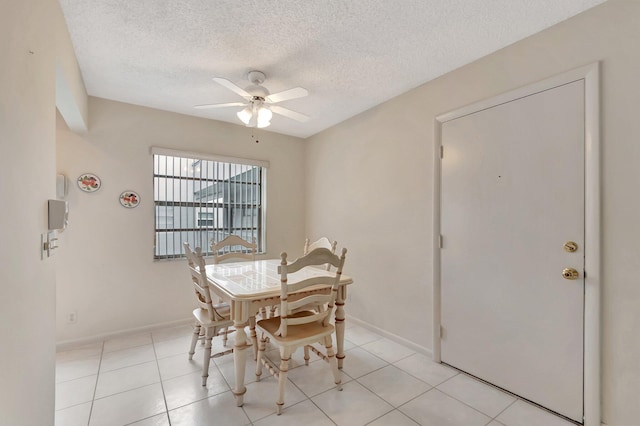 950 Flanders T, Delray Beach, FL 33484 - dining space featuring a ceiling fan, a textured ceiling, and light tile patterned floors