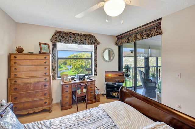 bedroom with ceiling fan, light wood-type flooring, and access to outside