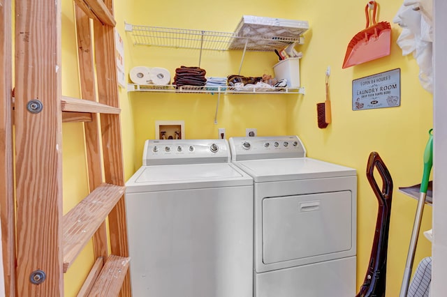 laundry room featuring washing machine and clothes dryer