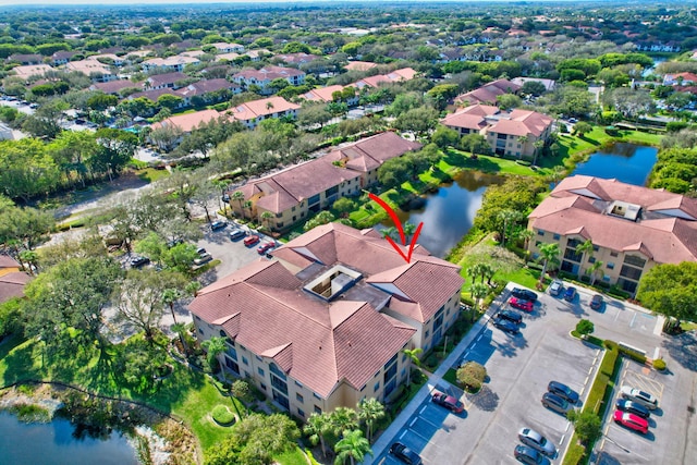 birds eye view of property featuring a water view