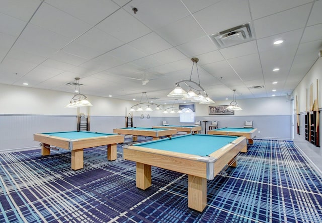 game room featuring a paneled ceiling, pool table, and dark carpet