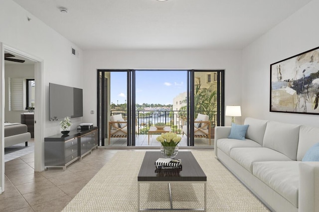 living area with light tile patterned flooring and visible vents