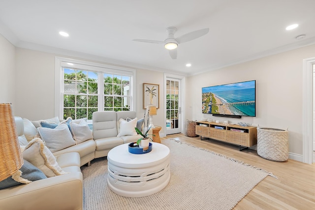 living area featuring a ceiling fan, ornamental molding, wood finished floors, and recessed lighting