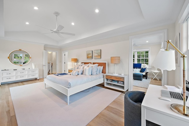 bedroom featuring a tray ceiling, lofted ceiling, recessed lighting, light wood-style flooring, and ceiling fan