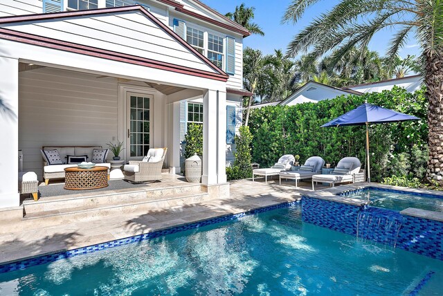 view of swimming pool featuring an outdoor hangout area, a patio area, and a pool with connected hot tub