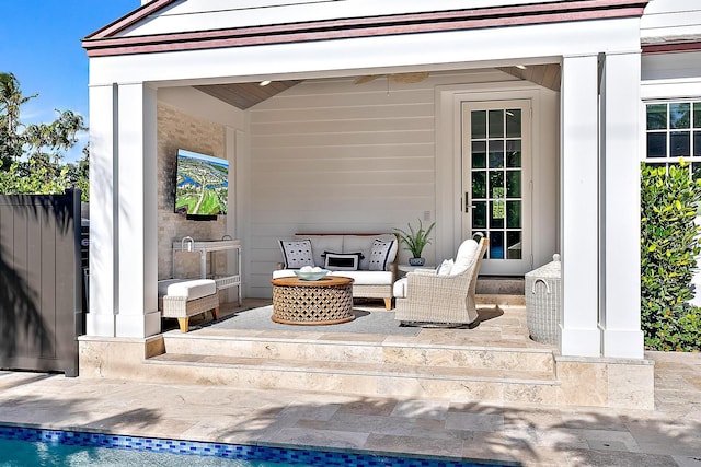 view of patio / terrace featuring an outdoor hangout area and fence