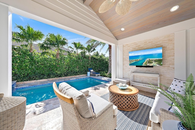 view of pool with ceiling fan and a fenced in pool