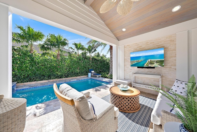 view of swimming pool featuring a fenced in pool, a patio area, ceiling fan, and fence