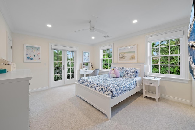 bedroom with light colored carpet, visible vents, access to exterior, french doors, and crown molding