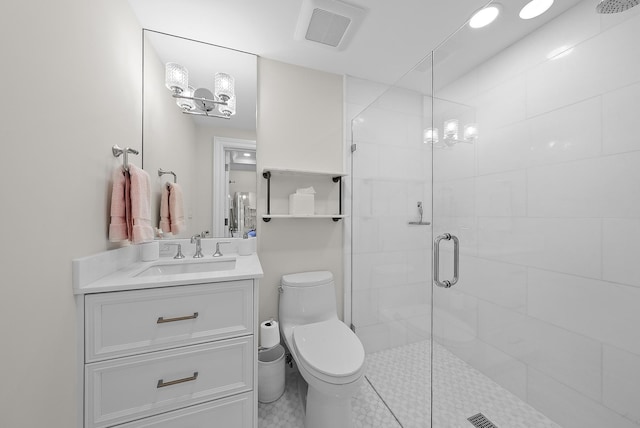 full bathroom with toilet, vanity, a shower stall, and visible vents