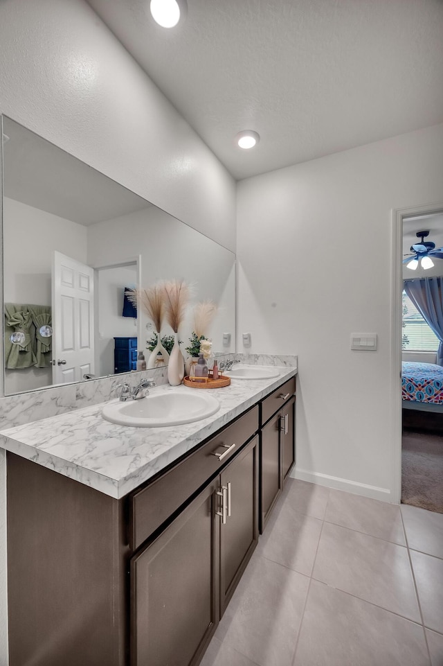 bathroom featuring vanity, tile patterned flooring, and ceiling fan