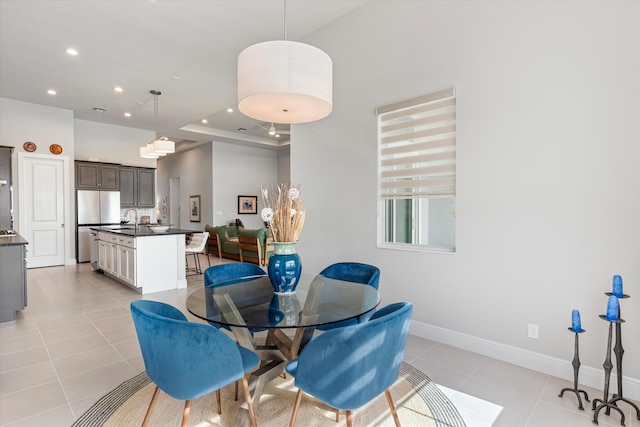 dining room with sink and light tile patterned floors