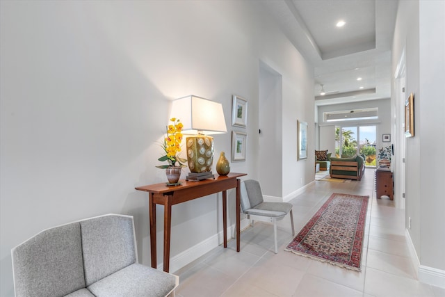 hall with recessed lighting, light tile patterned flooring, and baseboards