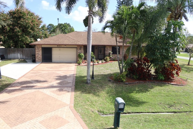 single story home with a garage and a front yard