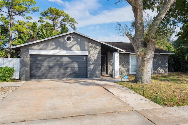 ranch-style house featuring a garage