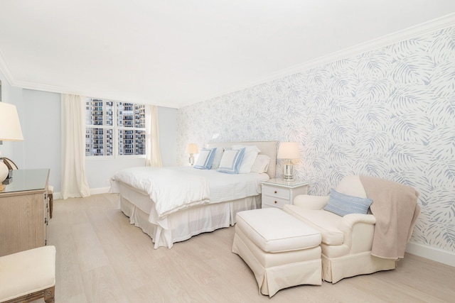 bedroom featuring crown molding and light wood-type flooring