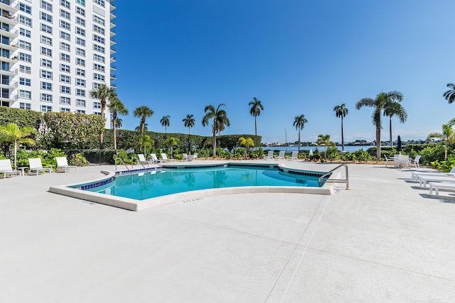 view of swimming pool with a patio area