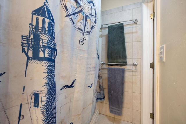 bathroom with tile walls and tile patterned floors