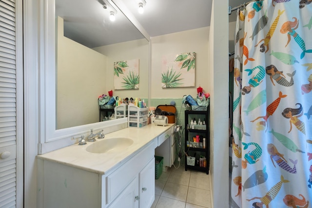 full bathroom featuring tile patterned flooring, vanity, and curtained shower